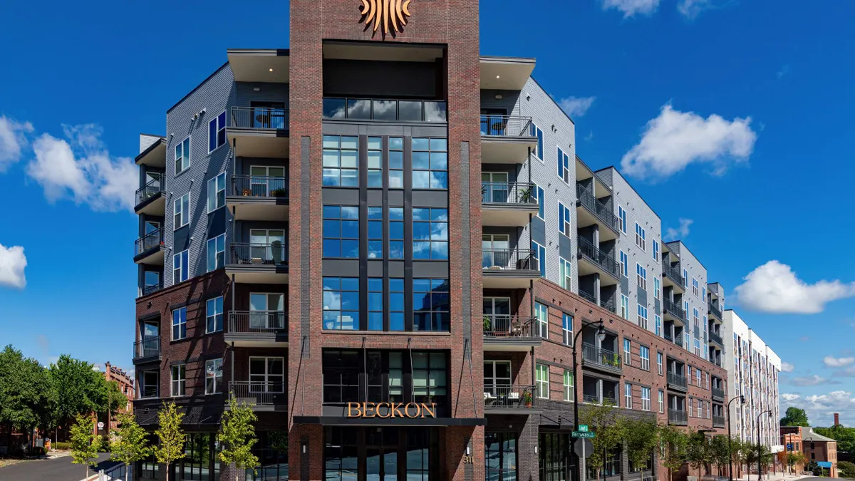 Brick, six-story apartment complex.
