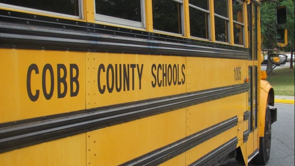 A yellow school bus labeled "Georgia Cobb County Schools"