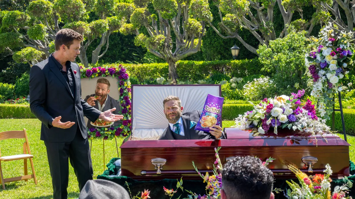 Former Patriots teammates Tom Brady (left) and Julian Edelman interrupt a funeral in a new ad campaign from Tostitos.