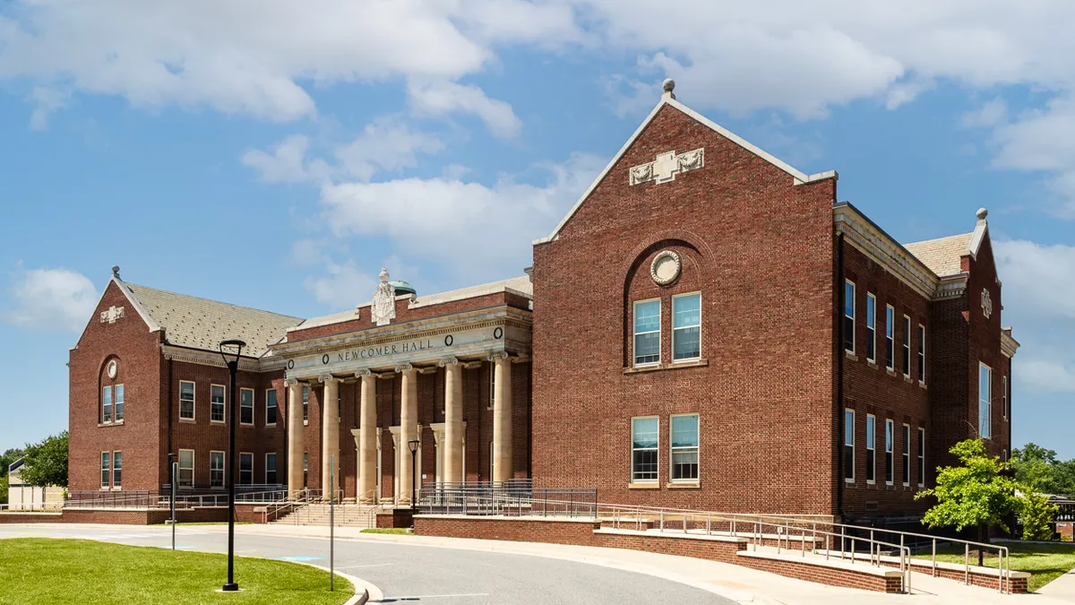 An academic building with classical columns is pictured on the campus of the Maryland School for the Blind.