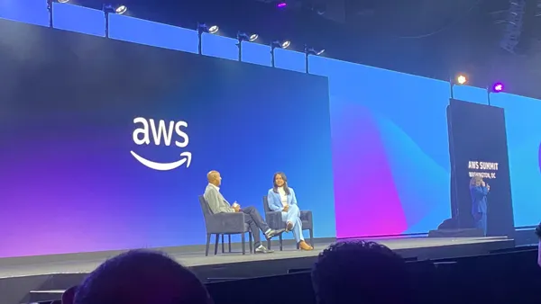 AWS VP of Worldwide Public Sector Dave Levy speaks with U.S. Director of National Intelligence Tulsi Gabbard on stage at the AWS Summit in Washington, D.C. on June 10, 2025.