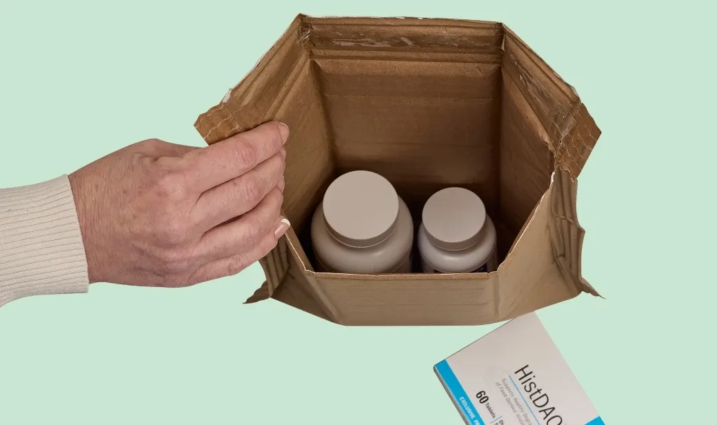 Cardboard packaging with two plastic bottles inside
