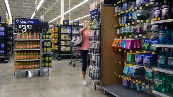 A person shops at a Walmart in Florida, next to an aisle of personal care products