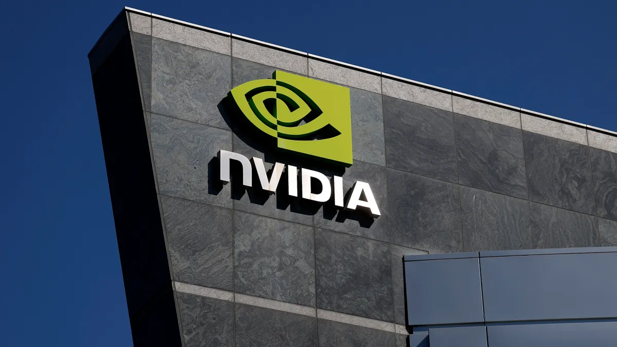 The Nvidia logo is displayed on a building at Nvidia headquarters on August 27, 2025 in Santa Clara, California.
