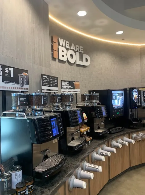 A photo of the coffee dispensers inside a TXB convenience store.