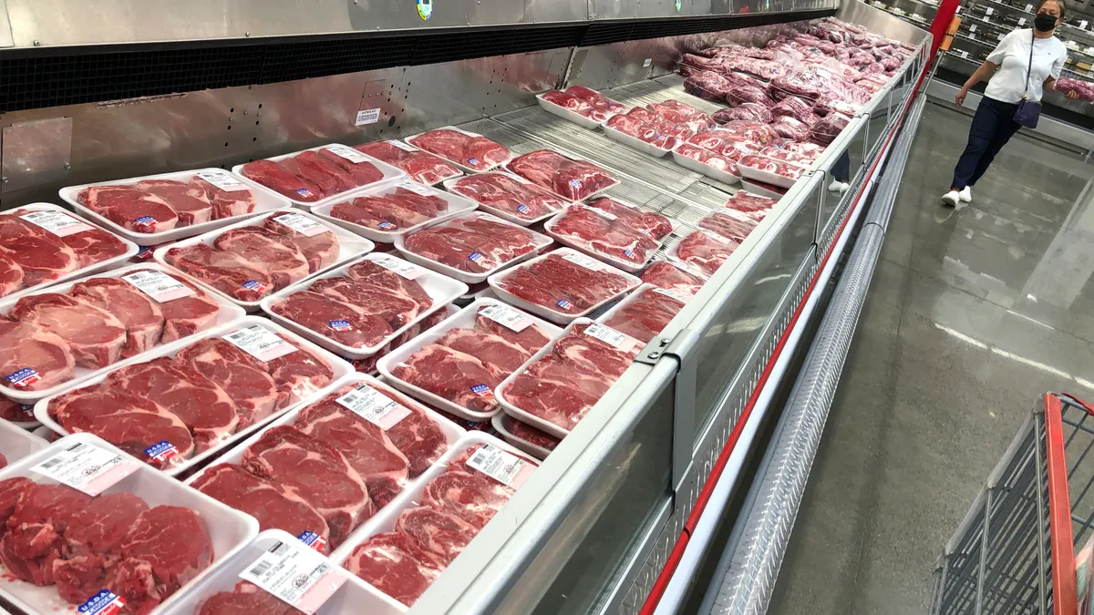 packages of beef steak are seen in a grocery store