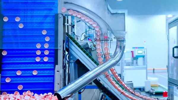 A manufacturing line produces plastic caps.