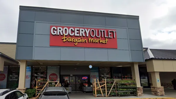 Grocery store with a sign that reads "Grocery Outlet Bargain Market" on a red background.