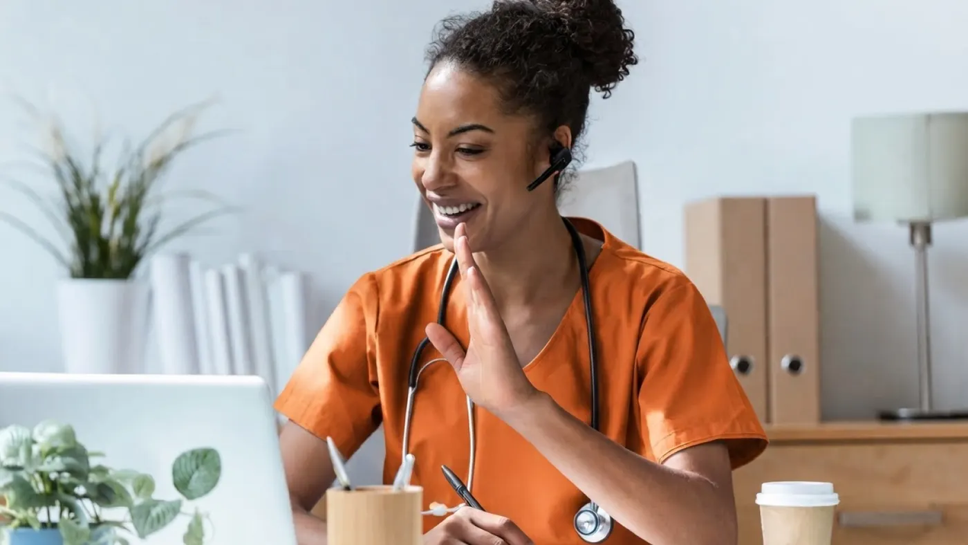 Medical worker in a video call, smiling