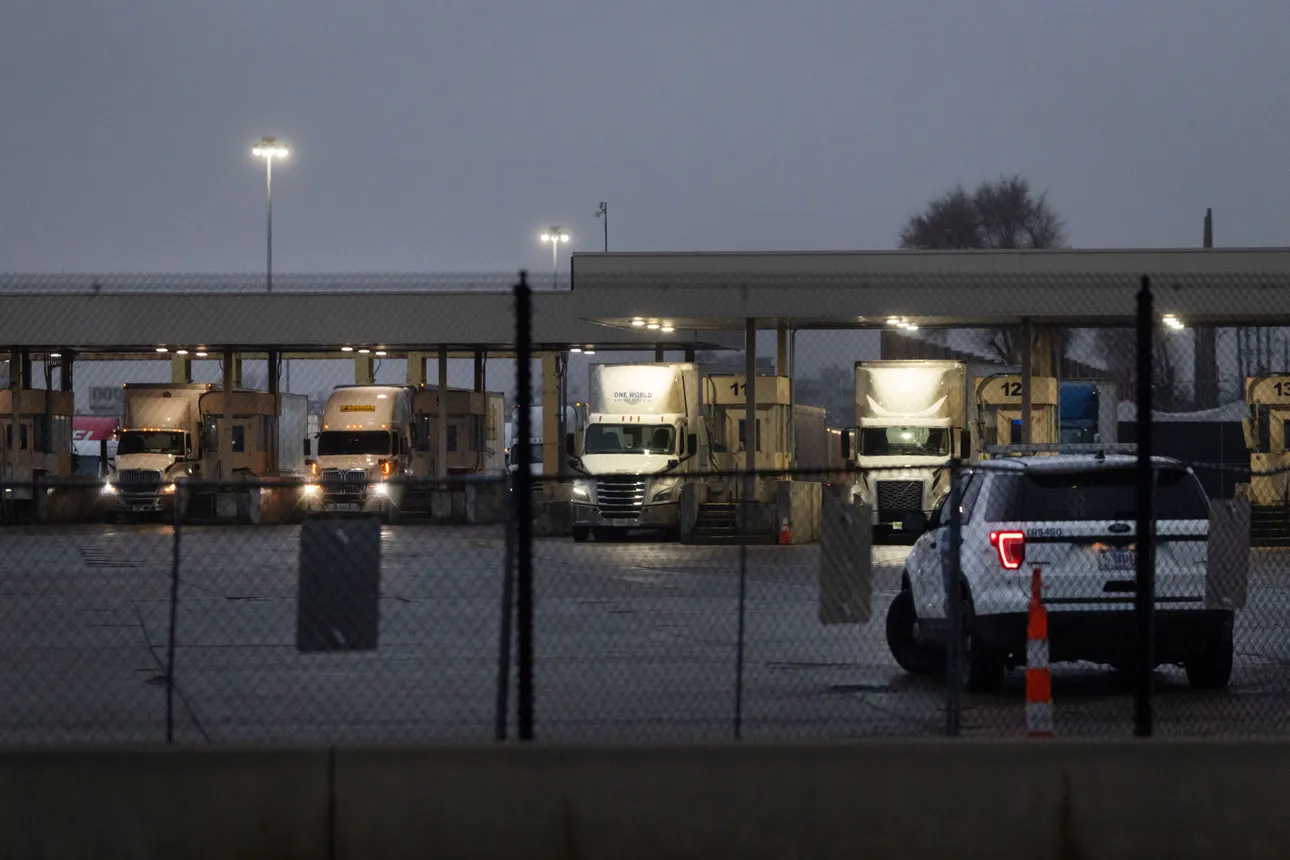 Trucks go through a customs checkpoint in Detroit while entering the U.S. from Canada on Feb. 3, 2025.