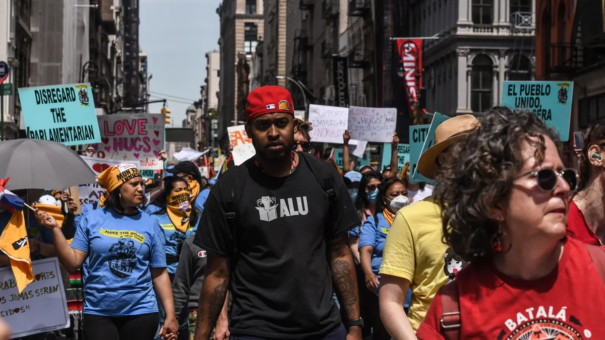 A Black man stands front and center at an Amazon Labor Union protest