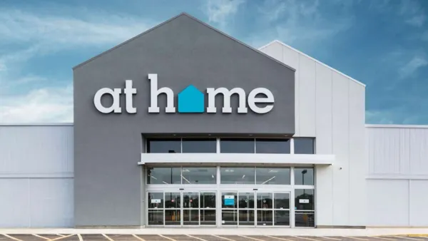 An At Home storefront with a blue sky background