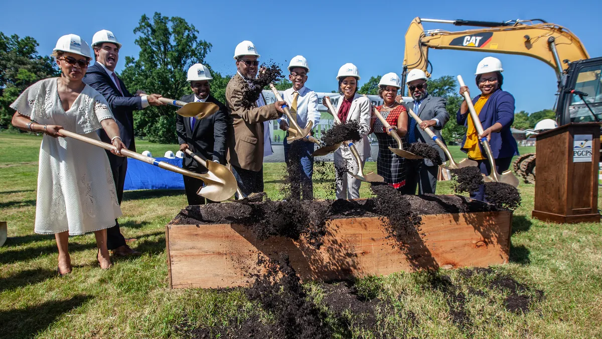 Officials with Prince George's County Public Schools in Maryland and Gilbane Inc. break ground on a new school June 28, 2021.