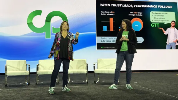 Two women present on a keynote stage