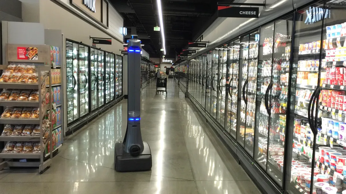 A robot in a grocery store aisle