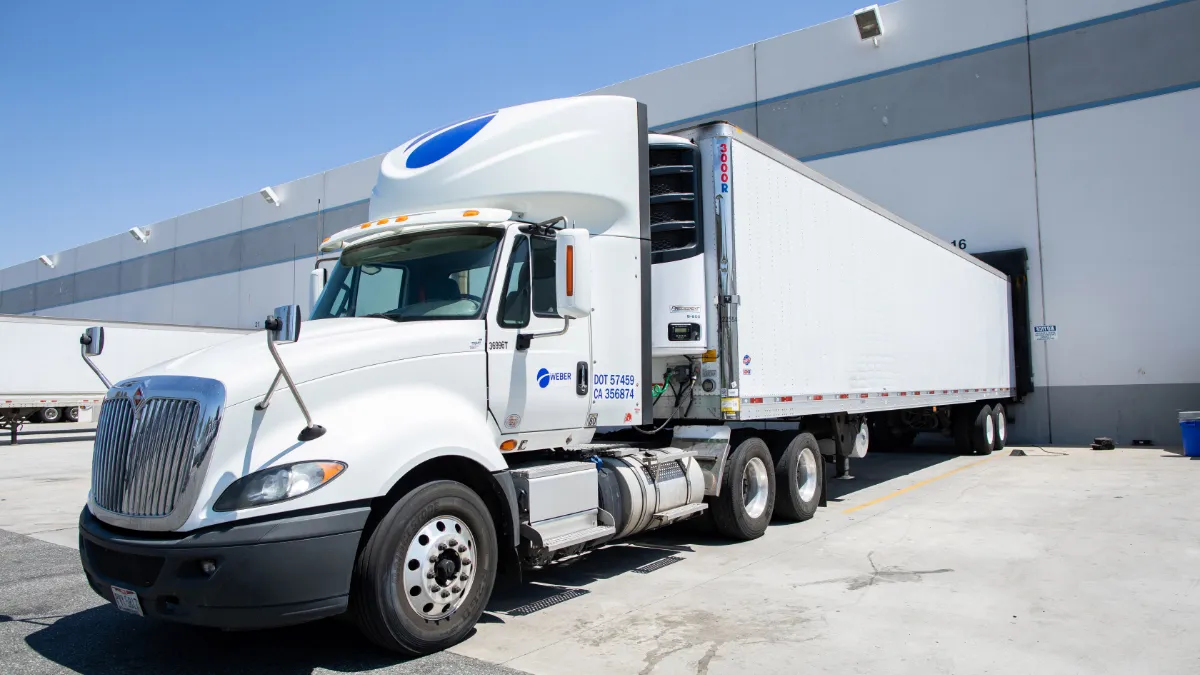 A Weber Logistics truck loading food at one of its distribution centers for delivery.