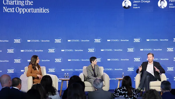 Panelists speak on stage during Semafor World Economy 2026