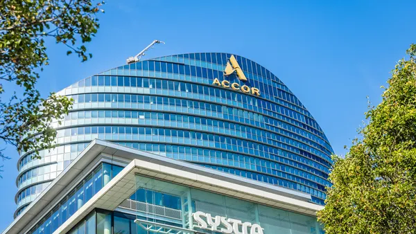 The exterior of Accor's headquarters on a sunny day.