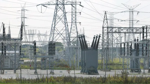 Transformers and power transmission lines at a power distribution yard August 18, 2003 in Des Plaines, Illinois.