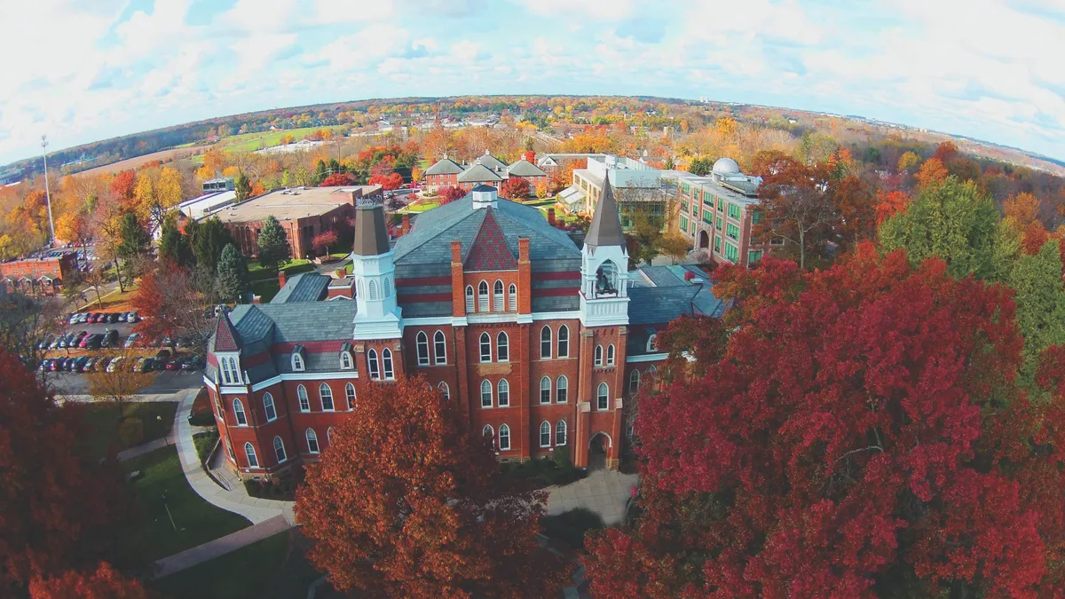 Brick buildings and fall foliage appear on Otterbein University's Campus.