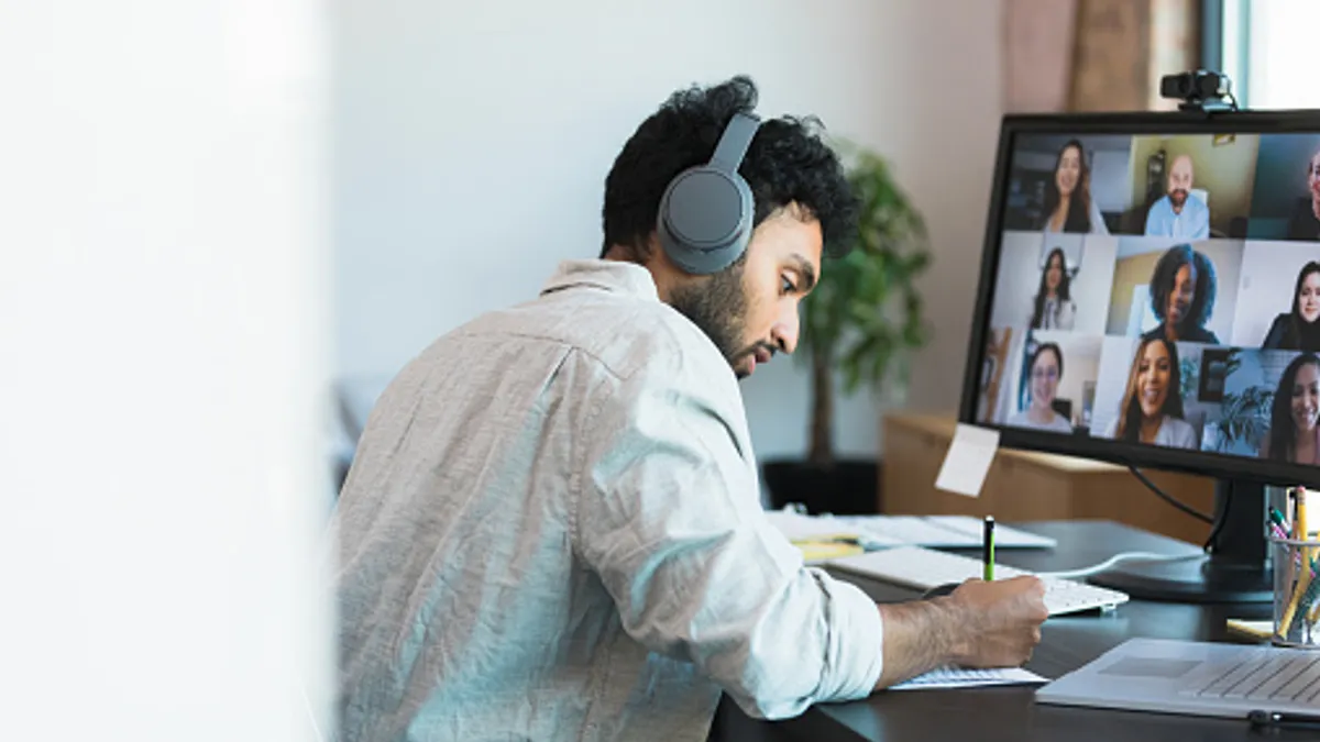 tech worker on a video meeting with team