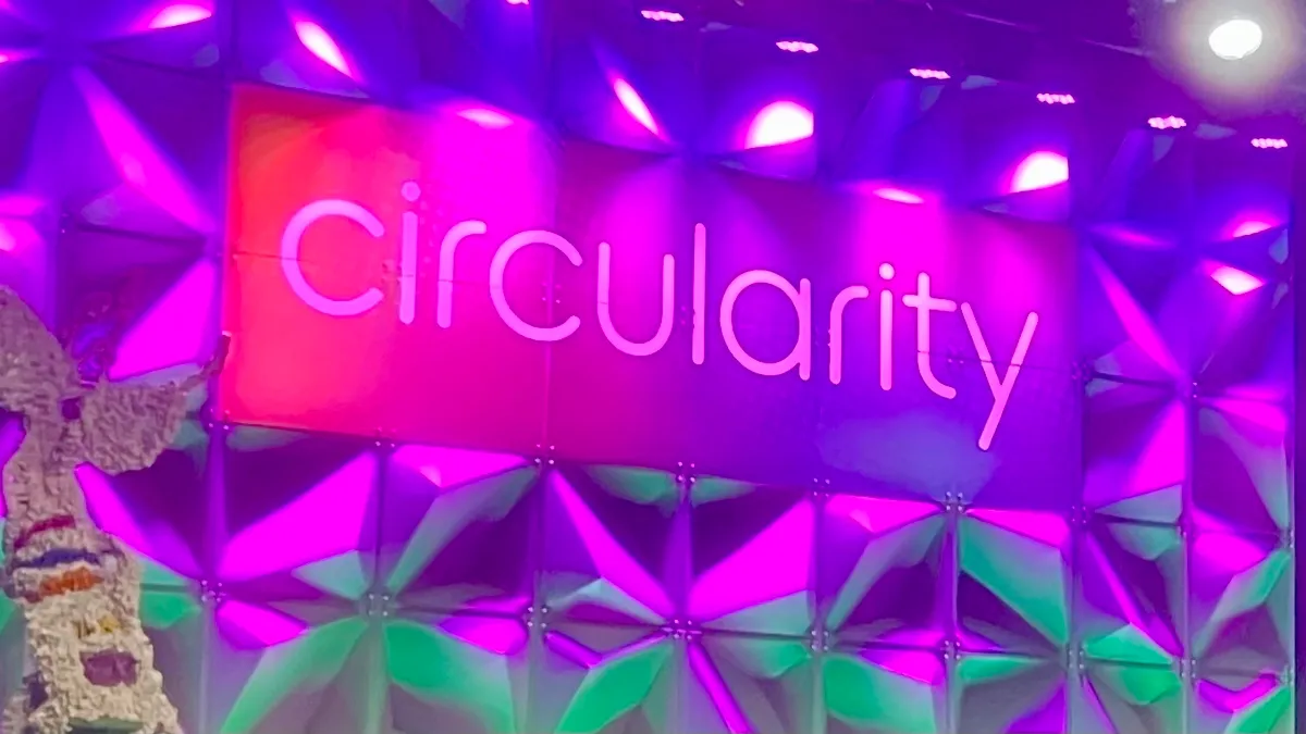 Pink main stage sign that says 'Circularity' at the Circularity conference