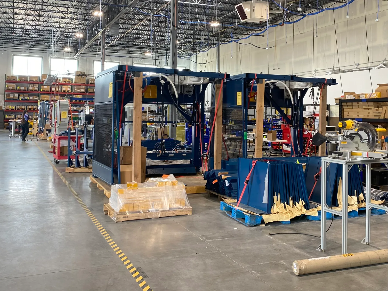 Cabinets for AMP Robotics' sorting systems sit in a warehouse at AMP Robotics