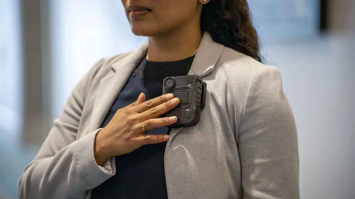 Woman using a wearable body camera