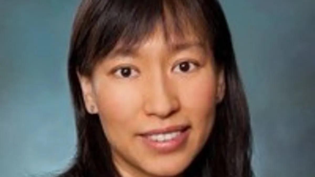 headshot of Judy Wang, CFO of IQ-EQ