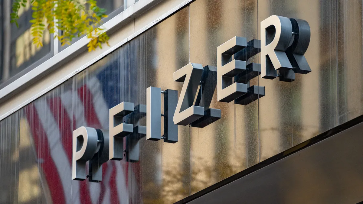 A sign for Pfizer is seen outside the Pfizer headquarters on November 9, 2020 in New York City.