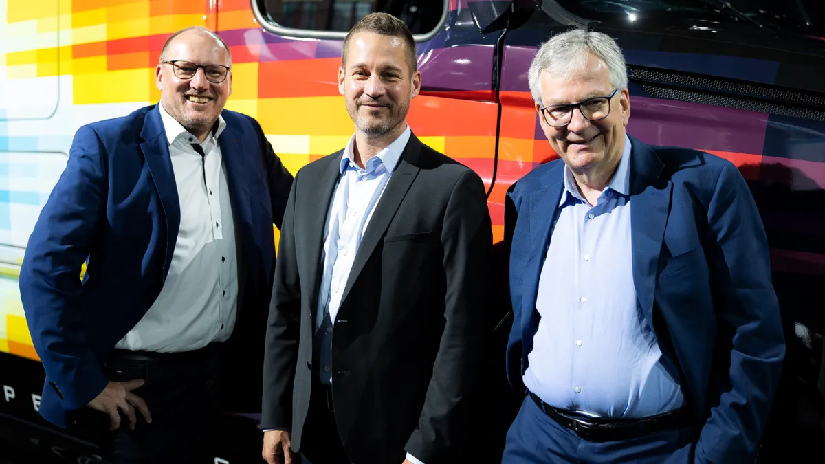 Jochen Goetz, Martin Daum pose with other Daimler AG executives