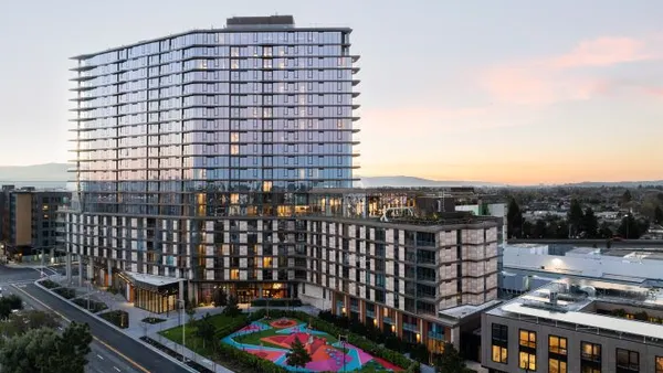 the exterior of a large luxury apartment building