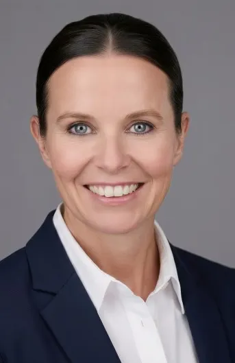 A professional headshot.
