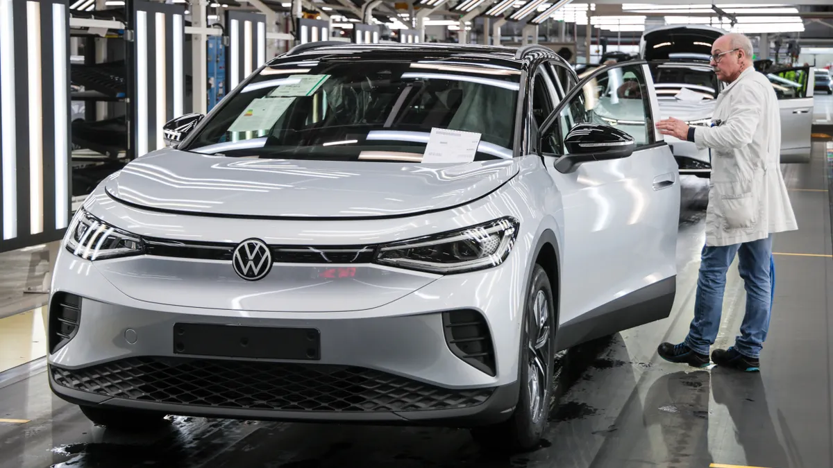 Volkswagen worker performing checks on an EV at the Volkswagen factory on Feb. 24, 2026.