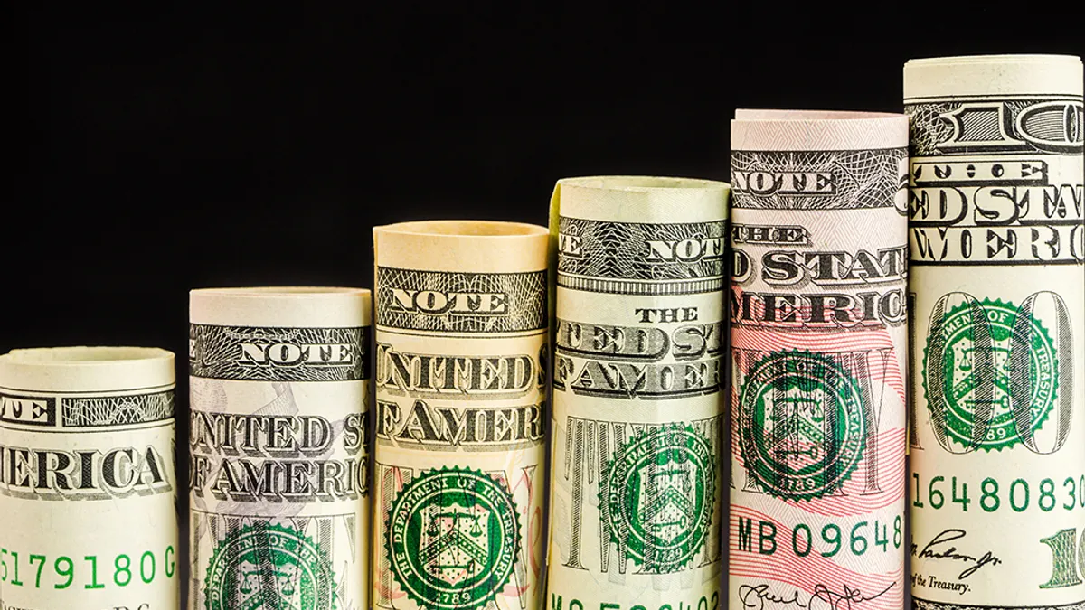 Rising steps made of rolls of all american dollar banknotes