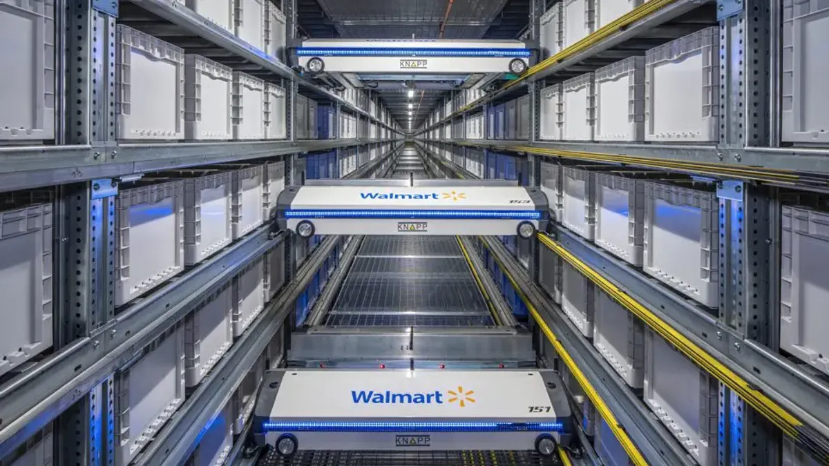 Walmart and Knapp-branded storage systems with wheels are in a warehouse.