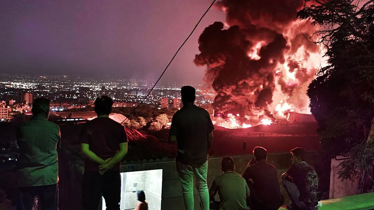 Fire and smoke arise after an attack on the Shahran oil depot in Tehran, Iran on June 15, 2025.