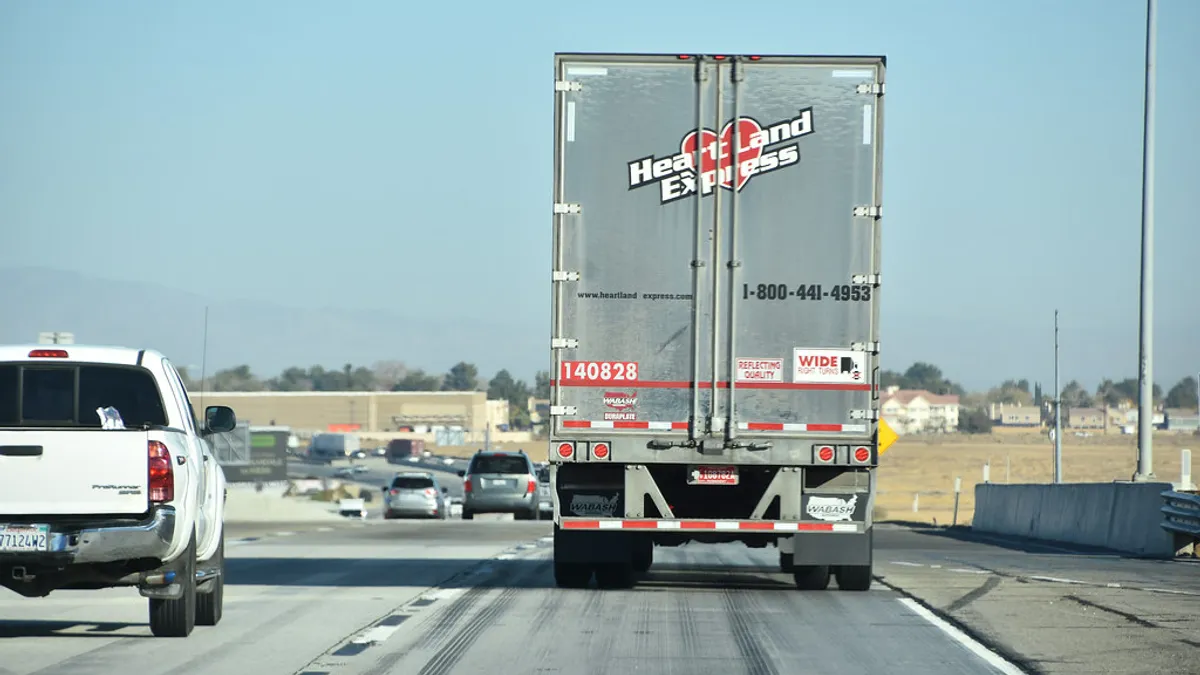 A Heartland Express truck takes a trip on the road.