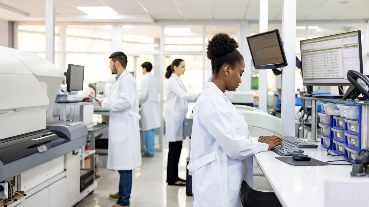 Multiracial group of scientists working at the laboratory researching