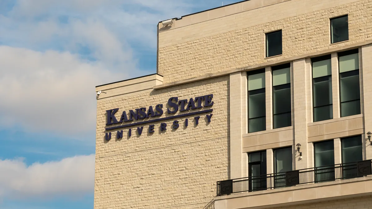A brick building with a sign that says "Kansas State University"