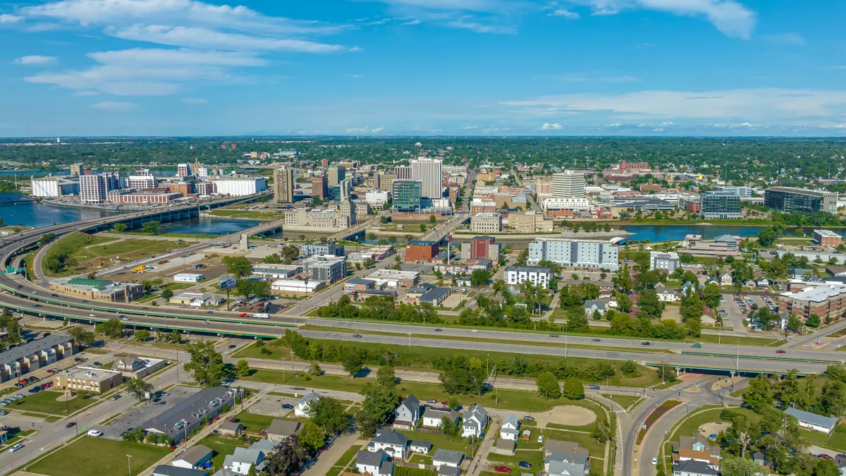 An aerial view of a downtown landscape on a sunny day.