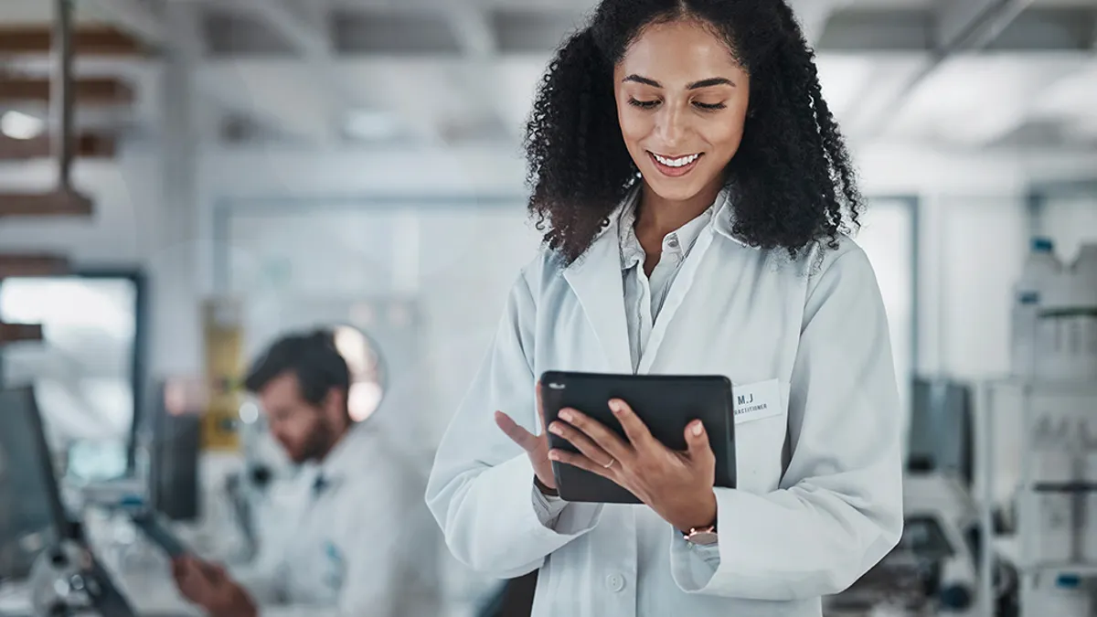 Medical professional looking at a tablet