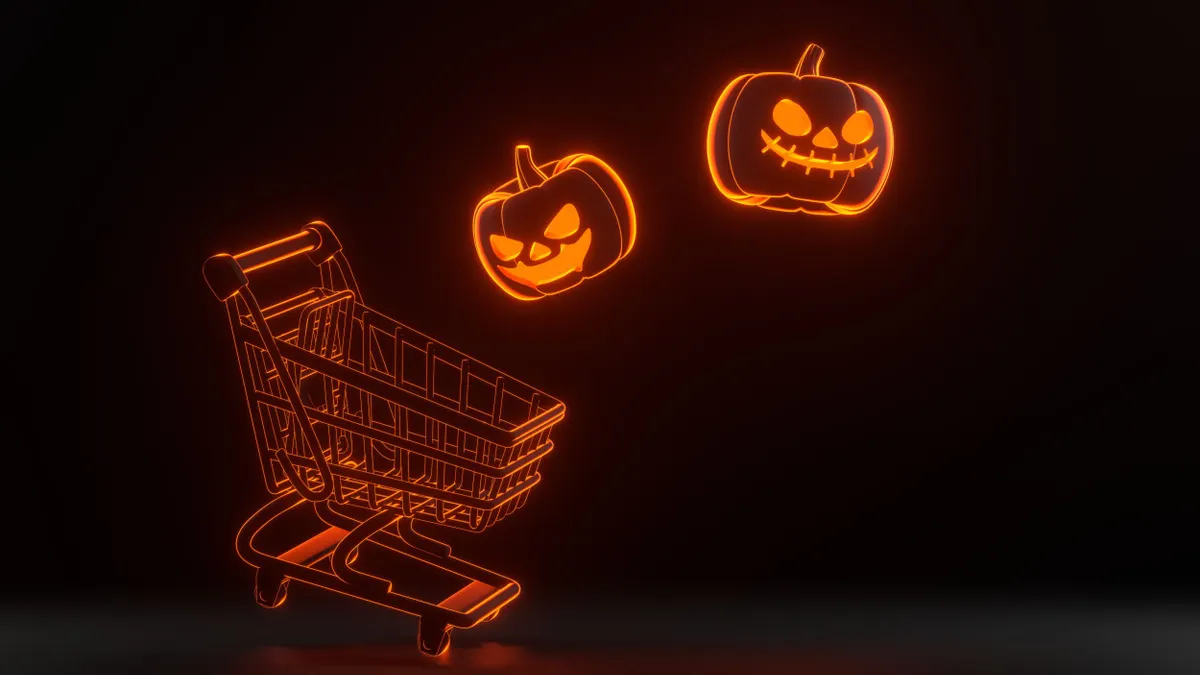Orange shopping cart with floating jack-o'-lanterns