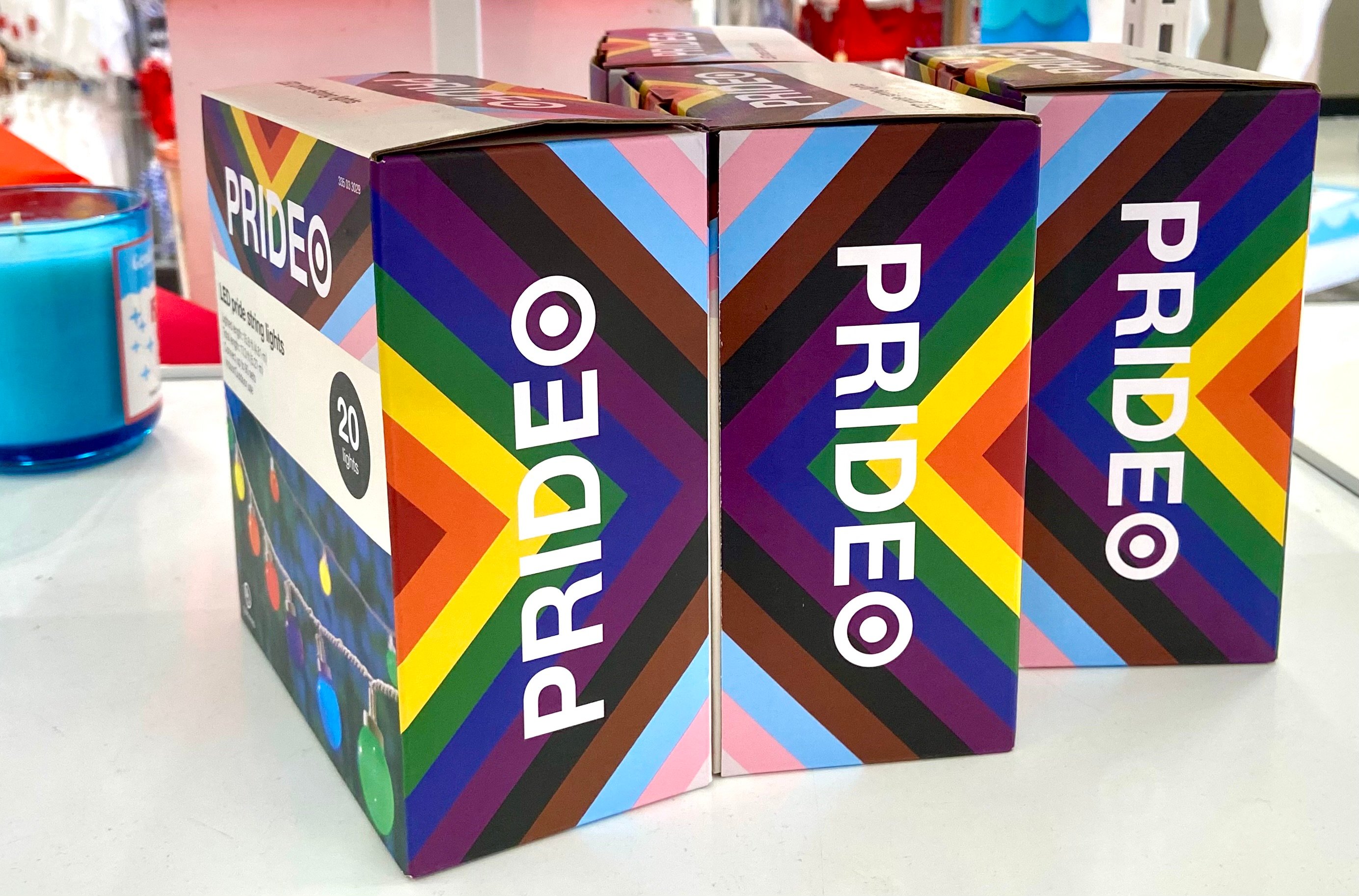 Boxes with rainbows sit on a store display.