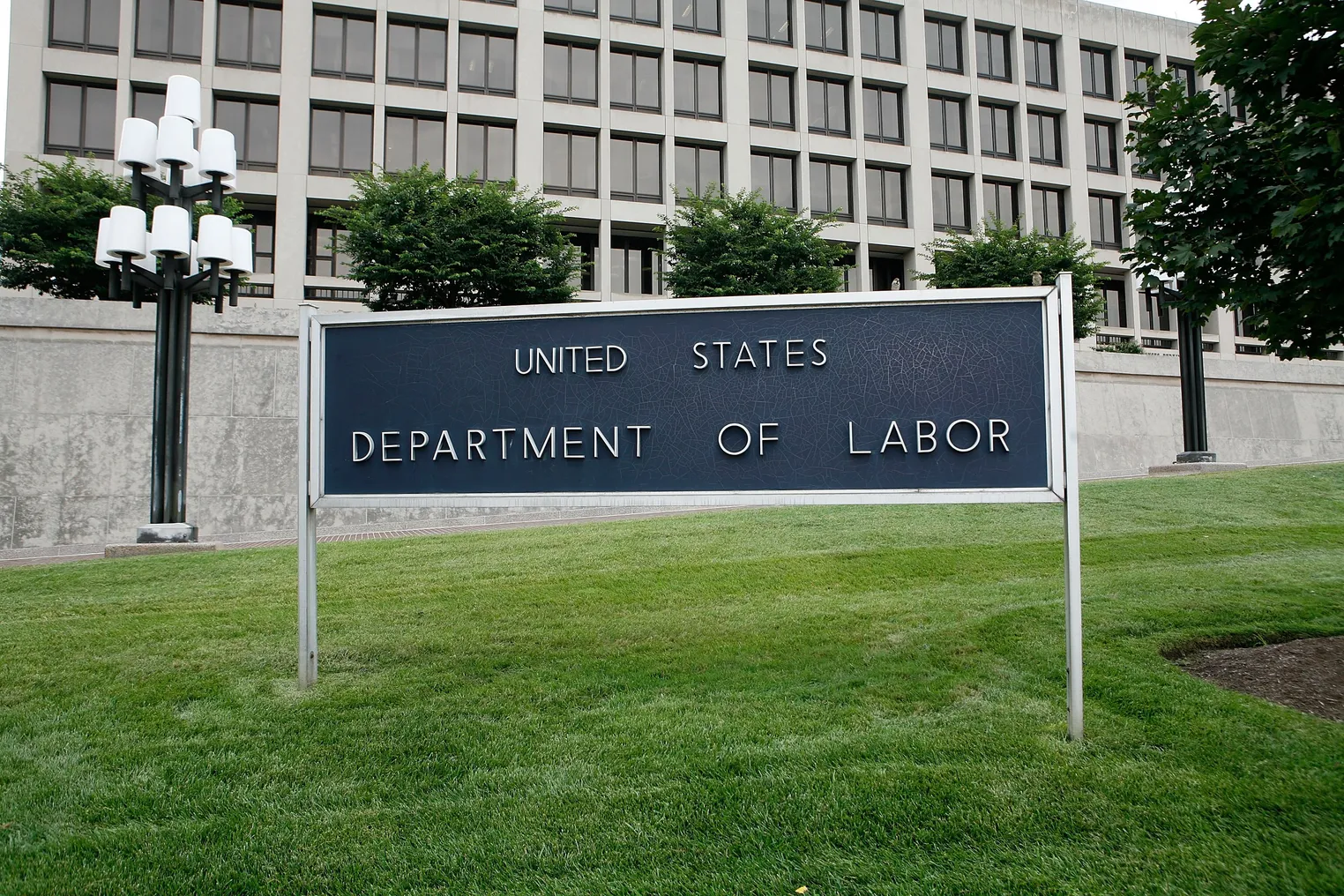 The exterior of the Labor Department building, with a sign that says "United States Department of Labor"