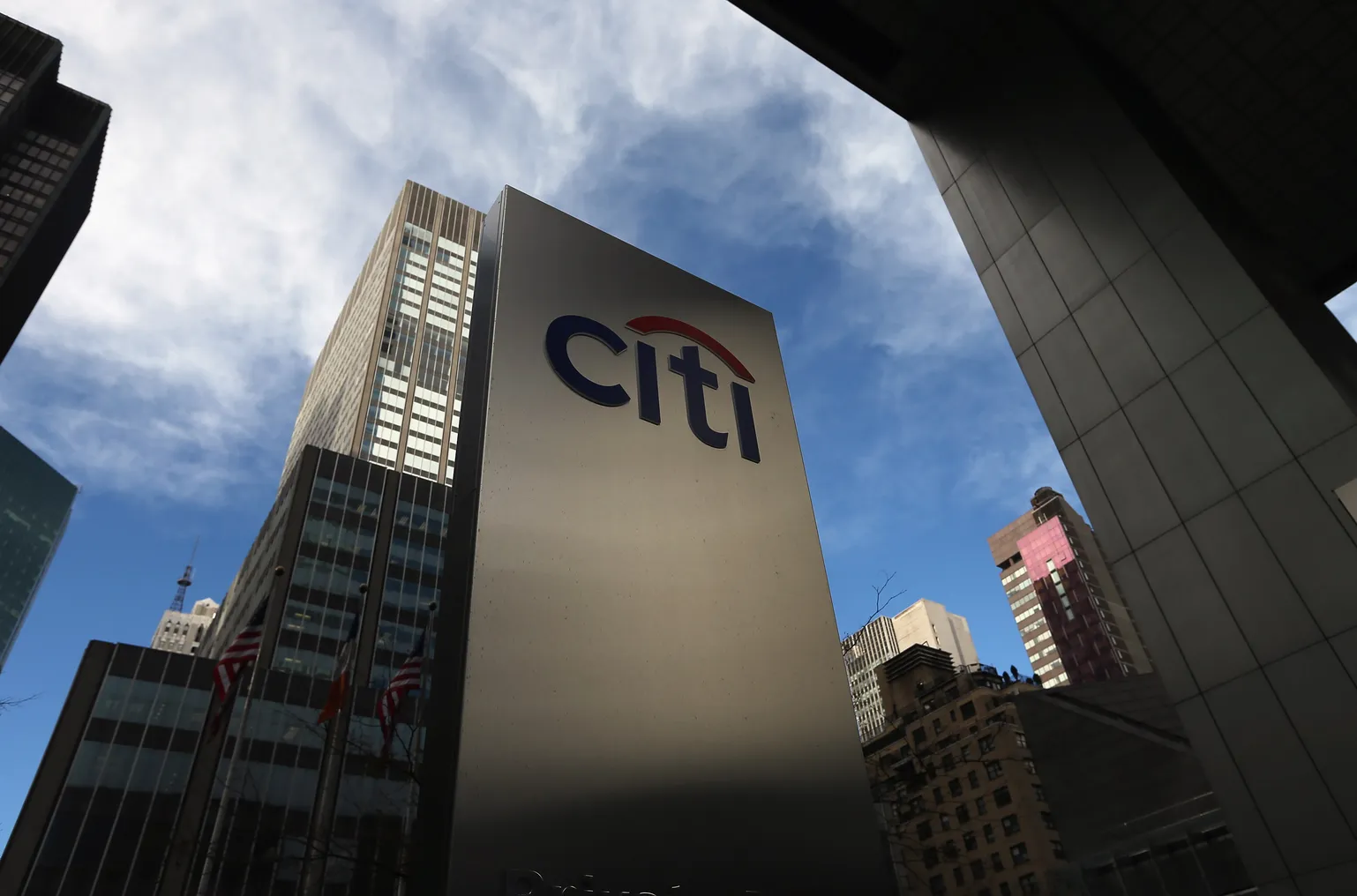 Outside shot of Citigroup HQ with a sign with the Citi logo in the shot