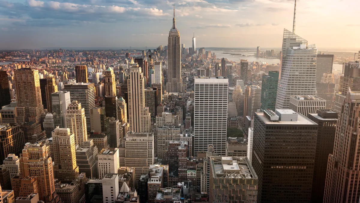 New York City skyline with urban skyscrapers at sunset