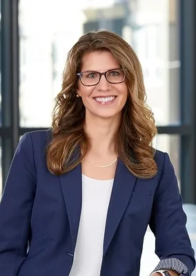Headshot of a woman in a blazer