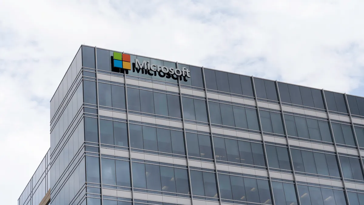 A large glass building with the Microsoft logo visible.