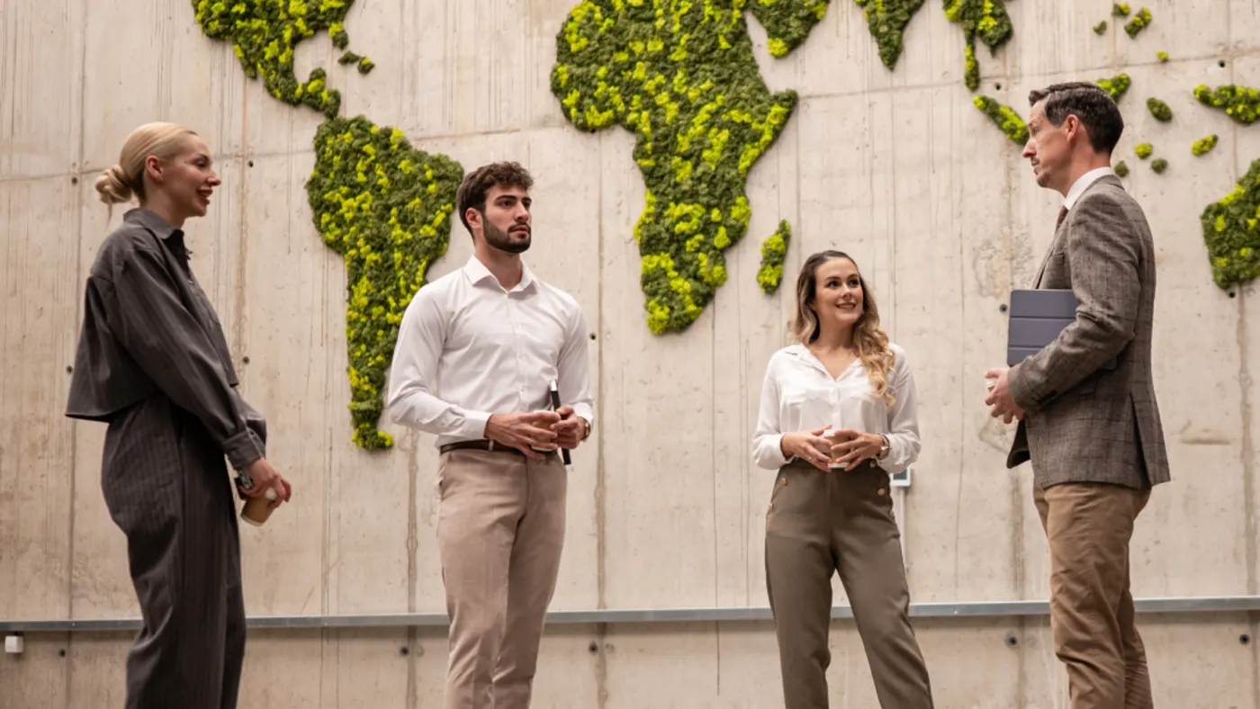 A group of people in business casual in a discussion